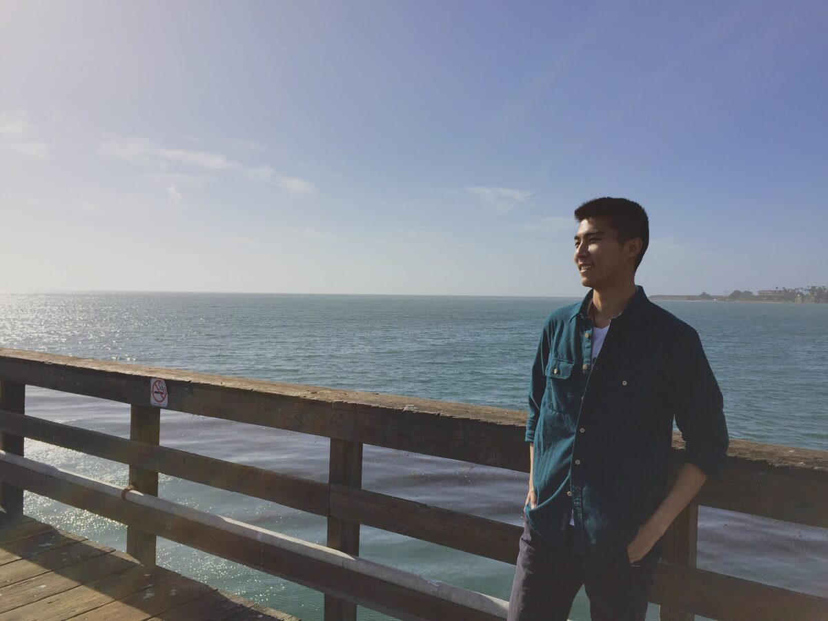 Hansi Liu on a pier by the sea